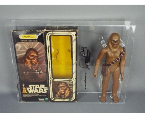 Star Wars, Denys Fisher - A vintage and graded 12" action figure of Chewbacca by Kenner. The figure only is a 'custom open gr