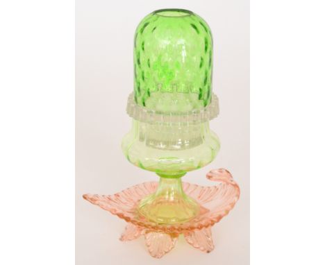 A late 19th Century Pyramid night light of Aladdin's Lamp form with a pale peach leaf form tray with handle below a waisted p