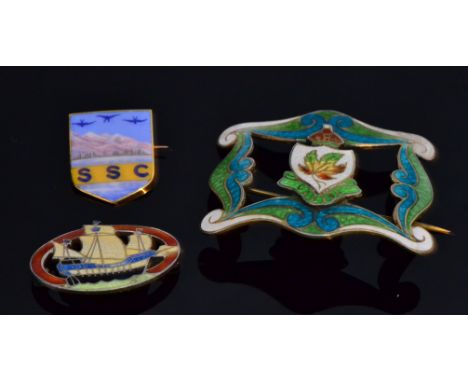 An early 20th Century Canadian Art Nouveau sterling silver and enamel buckle, the shaped scrolling border with white, lime gr