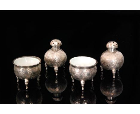 A pair of early 20th Century Chinese silver peppers, of globe form with pierced cover, all over engraved bamboo decoration an