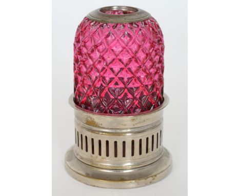 A late 19th Century Pyramid night light with a cranberry diamond moulded shade mounted to a white metal stand, height 11cm. 
