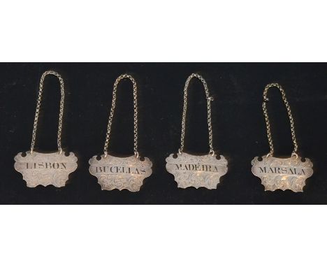 A set of four Victorian hallmarked silver decanter labels, Bucellas, Marsala, Lisbon and Madeira picked out in black enamel t