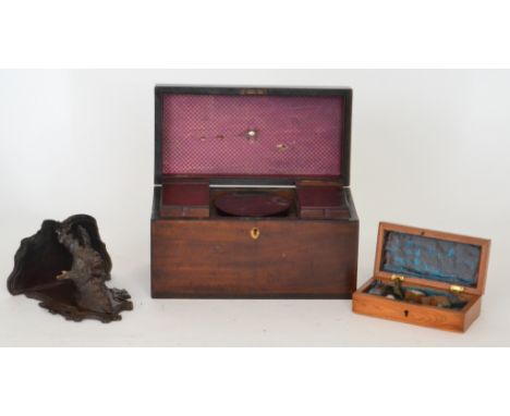 A George III mahogany tea caddy fitted with three hinged containers, together with a Black Forest wall bracket in the form of