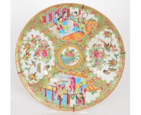 A late 19th to early 20th Century Canton enamel famille rose cabinet plate decorated with alternate cartouche panels of women