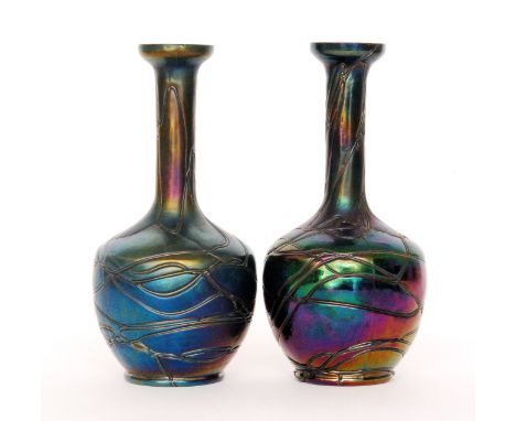 A pair of early 20th Century Kralik vases of footed globe and shaft form with flared collar neck decorated with random whipla