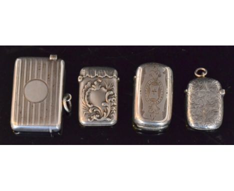 Two hallmarked silver vesta cases, one engine turned and another foliate engraved, together with a French silver and further 