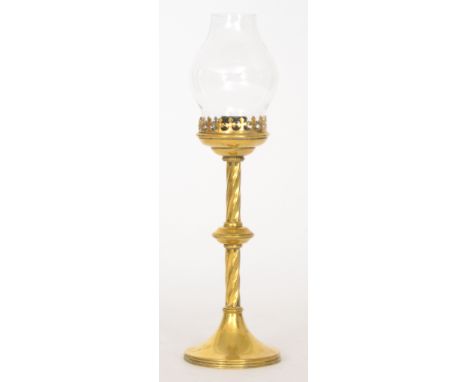 A 20th Century Gothic style brass candlestick with clear bulbous glass shade, height 35cm