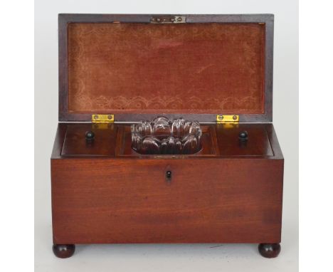 A 19th Century mahogany rectangular shaped tea caddy fitted with two compartments and a later glass mixing bowl on ball feet,