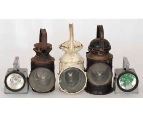 An LNER white painted railway signal lamp, two BR (M) black painted lamps and a pair of later chloride grey hand lamps. (5)