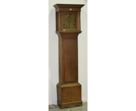 A 19th Century oak longcase clock by J Wilson, Askrigg, with eight day striking movement, engraved square brass dial and corn