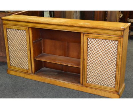 A 20th Century Regency style coloured chequer line inlaid maple bookcase, the centre shelf section flanked by a pair of cupbo