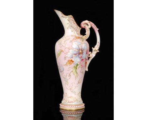 A late 19th Century Royal Worcester Prismatic Enamels ewer, model 1587, the body decorated with sprays of flowers and foliage