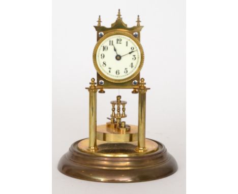 An early 20th Century 365 day mantle clock, Arabic dial in glass dome and brass base, height 32cm