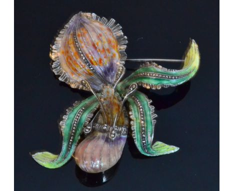 A silver, marcasite and enamel brooch formed as an orchid, enamelled in greens, pinks and purples, the leaves highlighted wit