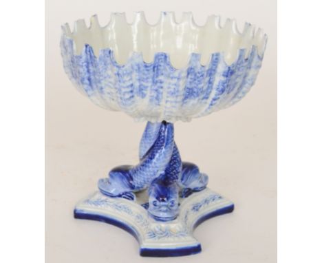 A 19th Century Royal Worcester sweetmeat dish, the pedestal modelled as three intertwined dolphins supporting the shell shape