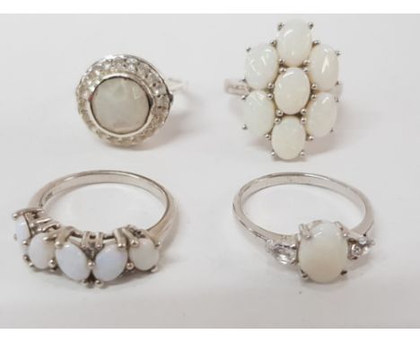 FOUR SILVER AND OPAL TYPE RINGS STAMPED SIZES R R 1/2 AND T 1/2 17.6G GROSS