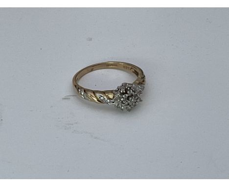 A 14ct gold quarter ct diamond cluster ring. R.