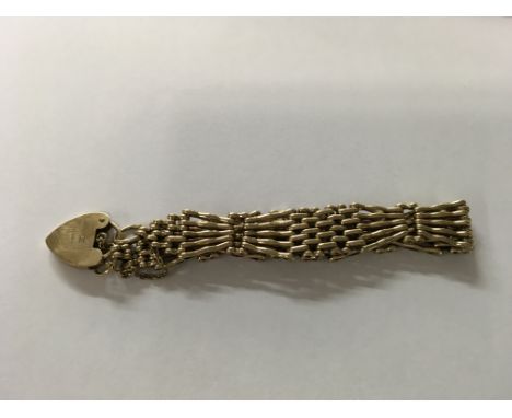 A 9 ct gold gate bracelet with heart clasp 21 grams.