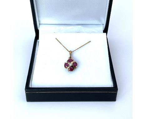 A 9ct yellow gold ruby and diamond necklace.