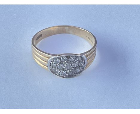 9ct gold ring set with a pattern of small of stones. Approx 2g. Ring size approx R.