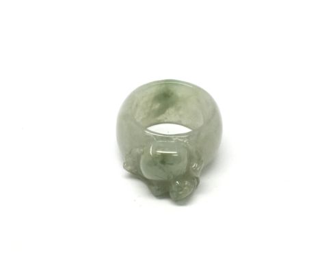 A jade ring carved in the form of a bat, approx size R.