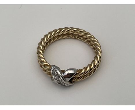 A heavy yellow and white gold rope twist design ring set with diamonds. Approx 7g, Q.