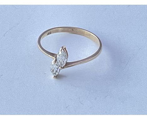 A 9ct gold ring set with two cut CZ. Approx 1g. Ring size approx R.