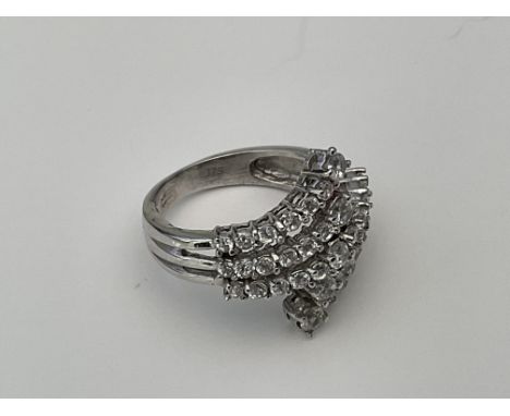 A 9ct white gold ring set with a CZ stones. Approx 4.4g, K.