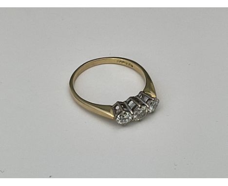 An 18ct gold and 3 stone diamond ring, approx 0.50ct. R.