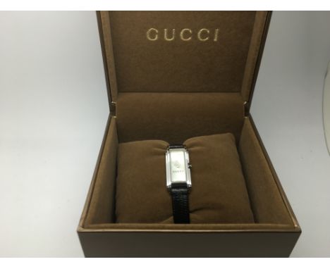 A boxed Gucci ladies dress watch with manual.