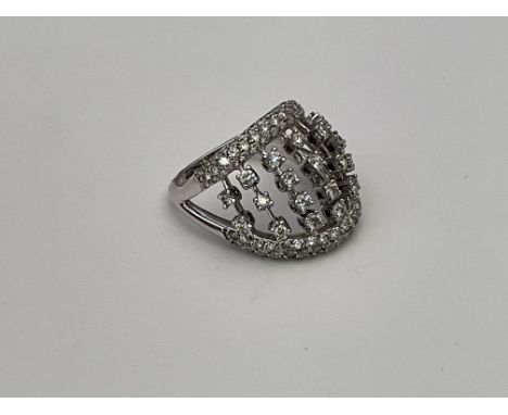 An unusual 18ct white gold and diamond set ring, R.