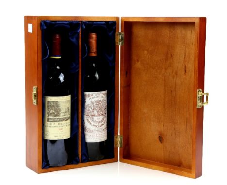 Two bottles of red wine in wooden presentation box with lining, including one bottle of Chateau Duhart-Milon Domaines Baron D