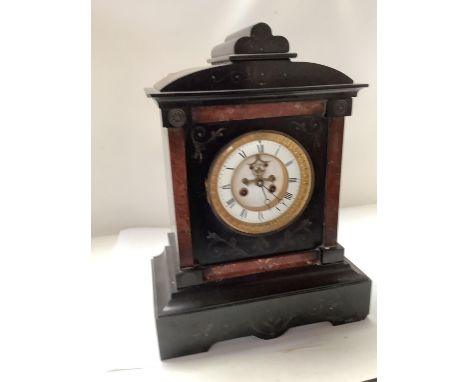 Victorian black slate chiming mantle clock, 43cm H. Condition: Losses and cracks to the case 