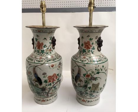 Pair of Chinese stoneware lamp bases, polychrome, decorated with birds and flowers, marks to base 56cm H to top of light fitt