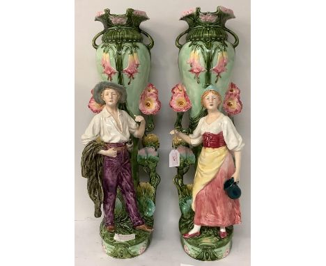Pair of Art Nouveau period majolica tall  vases, decorated with two figures, generally good condition, small chip to rim of m