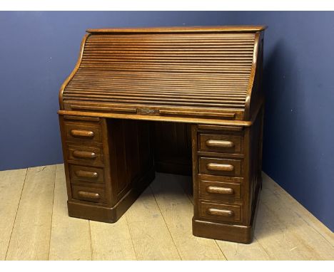 Good Victorian honey coloured oak roll top desk with fitted interior 128cm L x 126cm x H x 81cm D. Condition: Generally good,