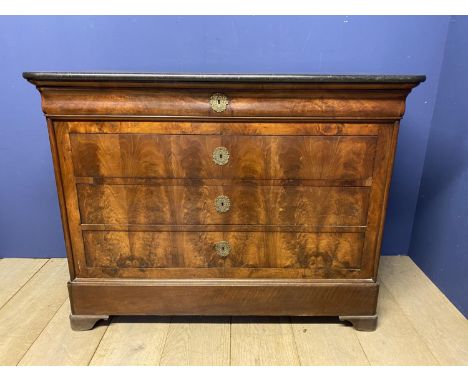 C19th French fruitwood commode of 3 long graduated drawers beneath a shaped drawer &amp; black marble top 130cm L x 59.5cm D 