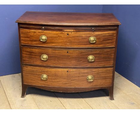 Regency mahogany bow front chest of 3L graduated drawers with brass drop handles below a slide on splayed slender bracket fee