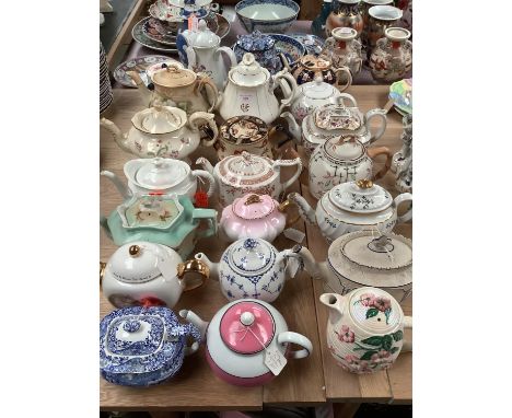 Collection of 18 china and earthenware teapots, including Spode Italian pattern, two Maling and another hot water jugs, and a