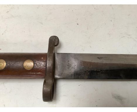 WWII polished steel blade dagger in a black leather scabbard, the leather stamped 860 and other marks, the blade and handle s