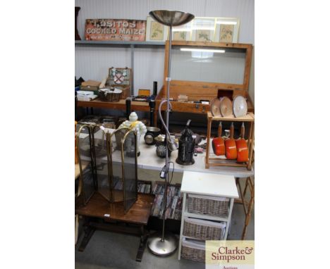 A metal uplighter with adjustable reading lamp