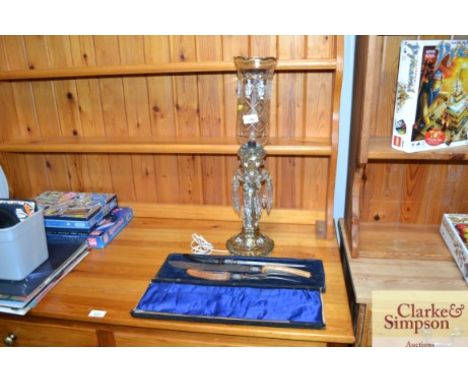 A boxed bone handled carving set and a table lamp
