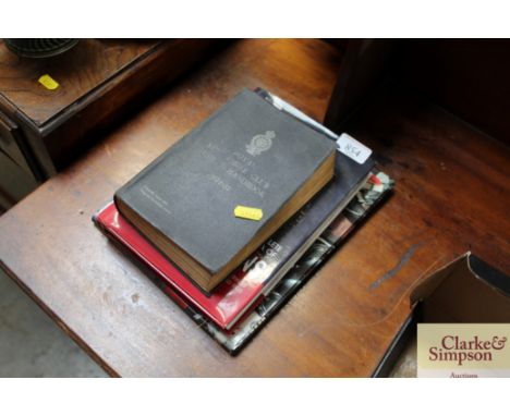A book, "Triumph the Legend", "The Complete Encyclopaedia of Chickens" and an edition of "Royal Automobile Club Guide and Han