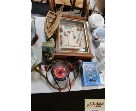 A boating diorama; small pond yacht; book ends; French horn; compass; DVD set etc