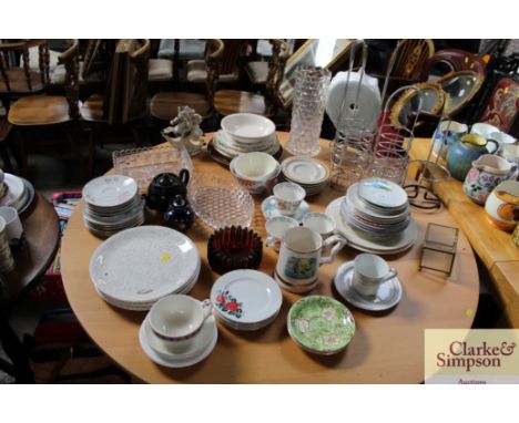 A quantity of various china plates, cups, mugs, glass vase, wine holders etc.