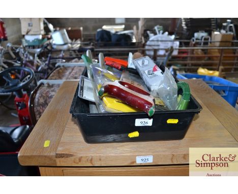A plastic tray of new and second hand tools