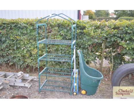 A plastic garden caddy, plastic trolley box and a garden rack