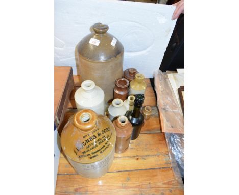 MIXED LOT OF STONEWARE AND GLASS VINTAGE BOTTLES AND FLAGONS TO INCLUDE SOME LOCAL INTEREST