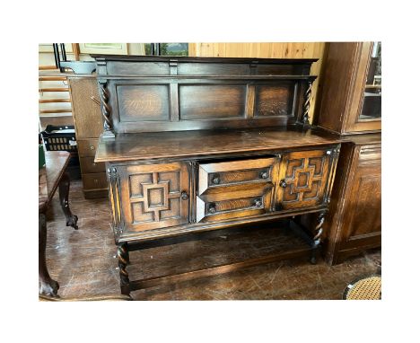 Oak Dresser&nbsp; with 2 Cupboards and 2 central drawers, Panelled back with small ledge/shelf.&nbsp; 5' wide x 4'10" high x 