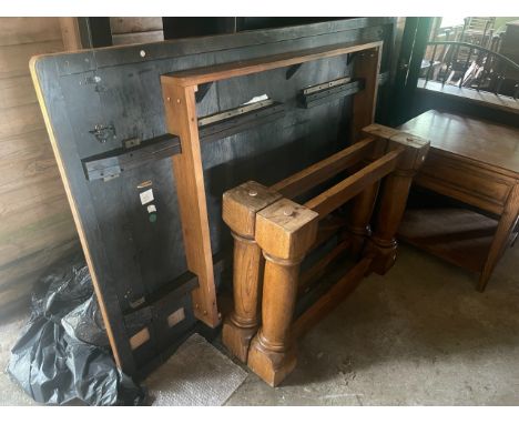 An oak refectory table, 20th century, crossbanded single plank, cleated ends adjustable top, raised on baluster supports; a s